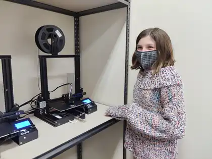 A student at the 3D printer as her band prints